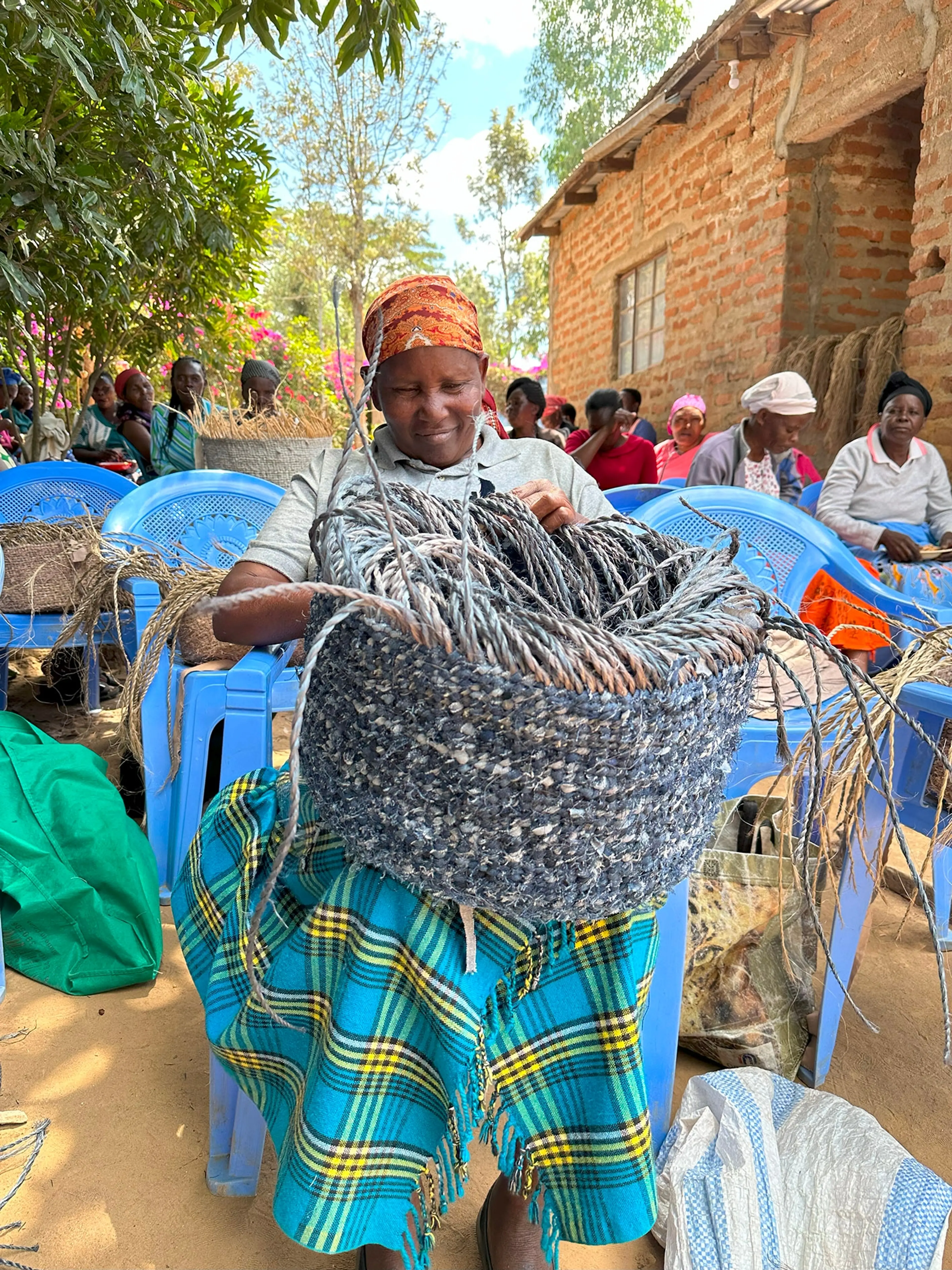 Woman holding basket made from recycled denim