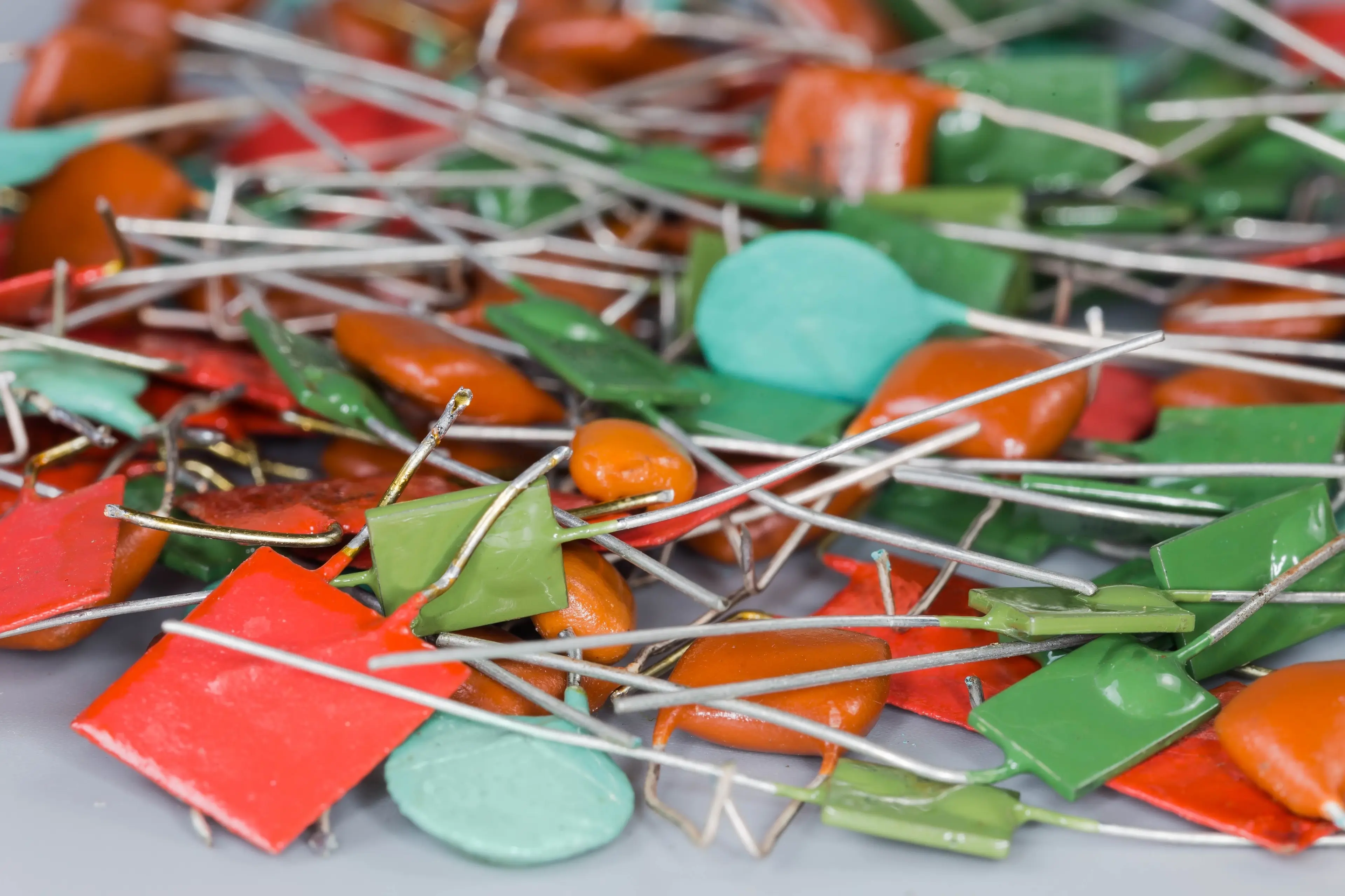 Pile of colourful biax film capacitors