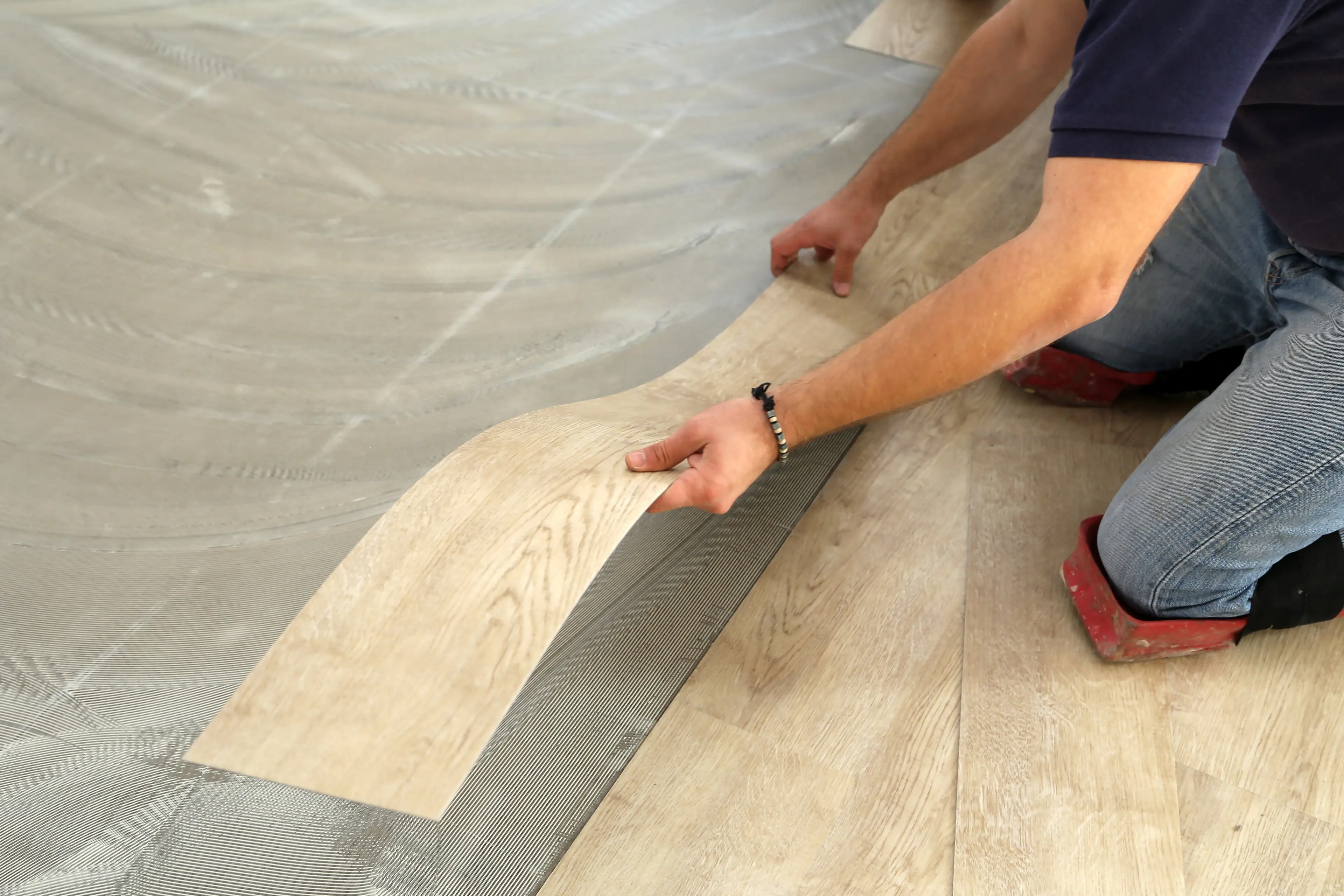Man laying vinyl flooring