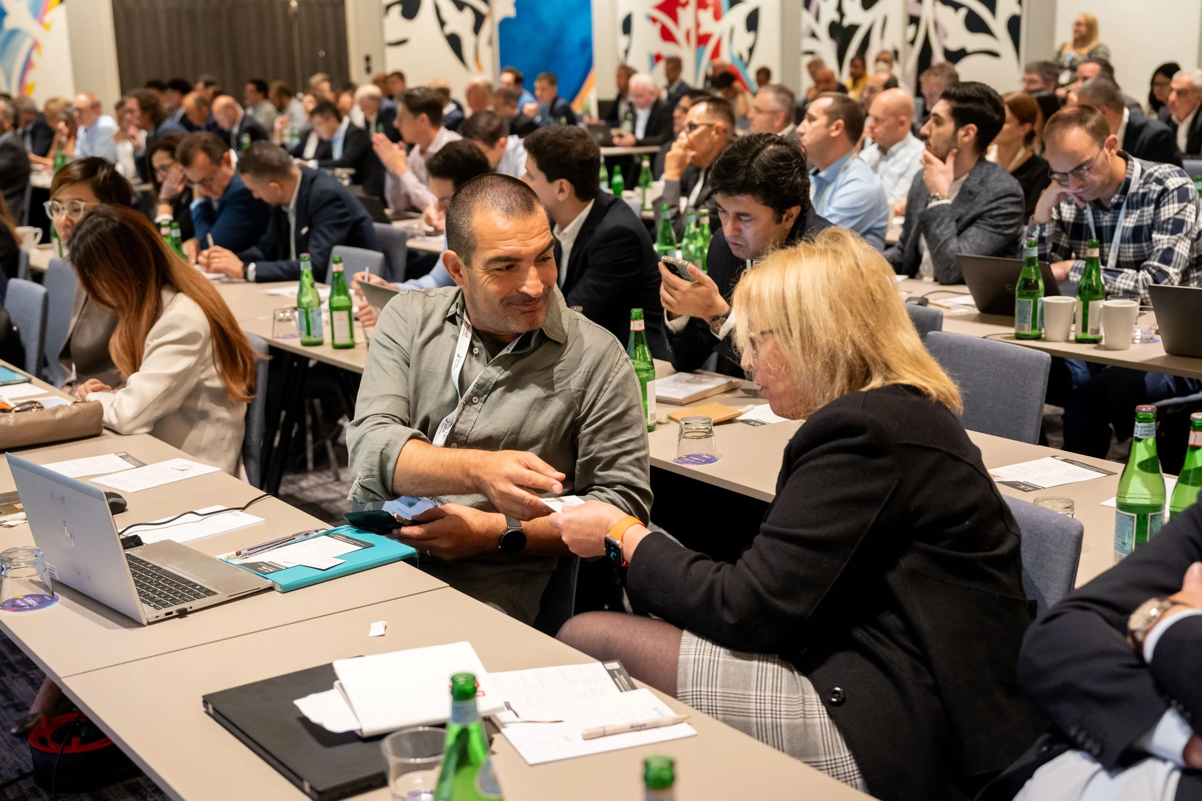 Man and woman talking at conference