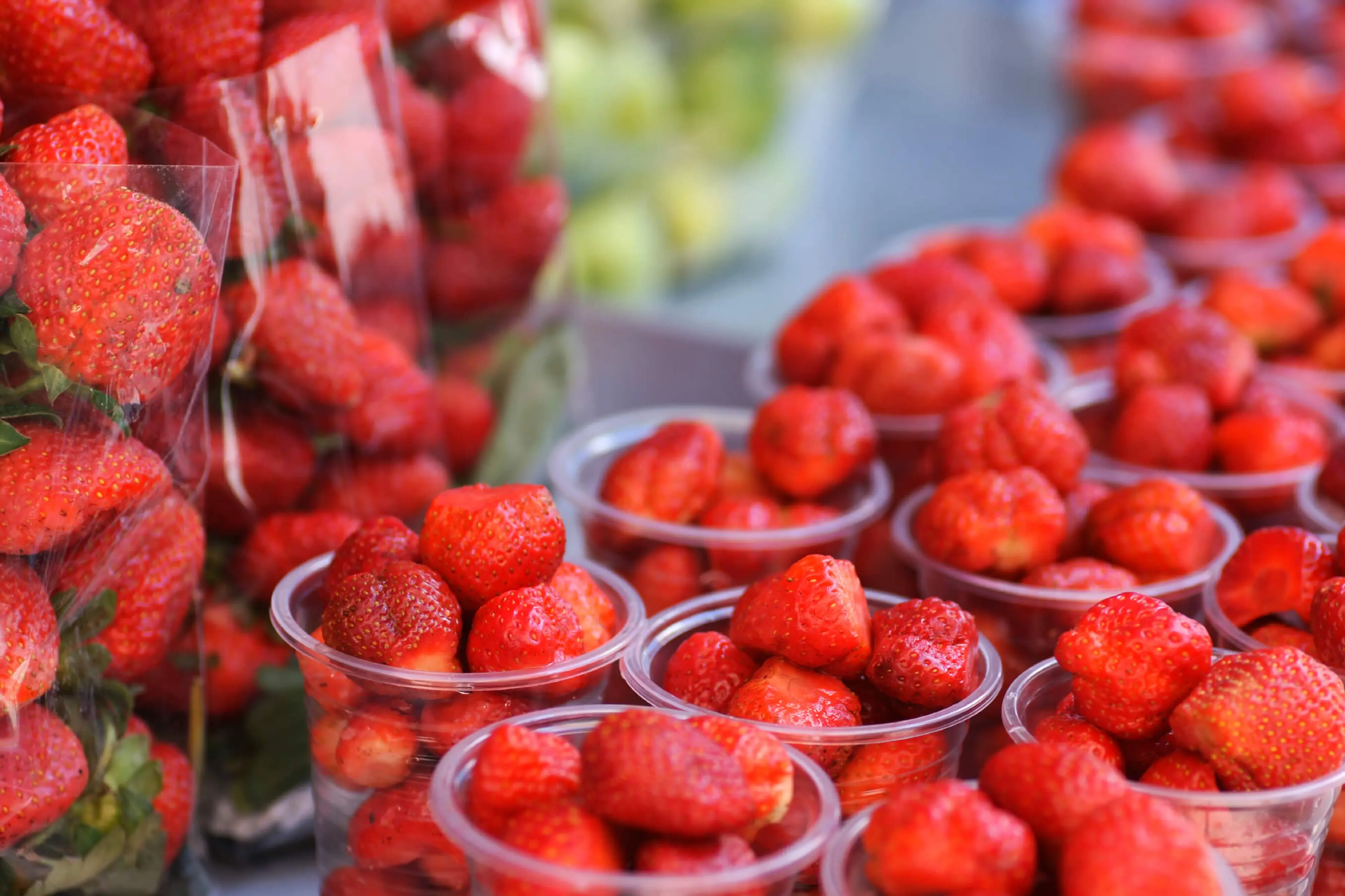 Plastic cups of strawberries